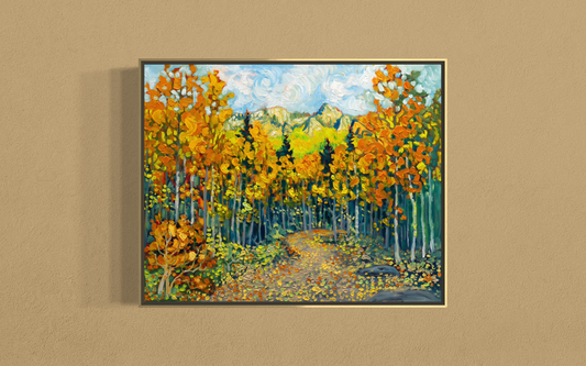 A framed vertical canvas painting of an autumn forest path, featuring vibrant orange and yellow trees, green and blue mountains in the background, and a swirling sky, displayed on a textured beige wall.